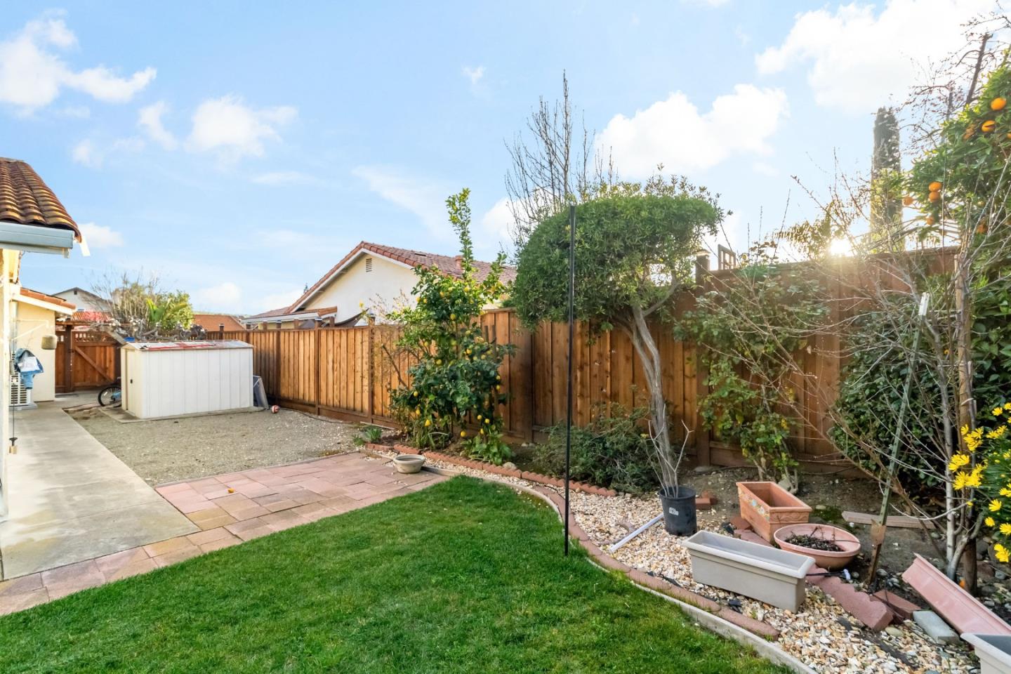 2831 Riedel Road San Jose, CA 95135 - Photo 44 of 53 a view of a patio with a table and chairs under an umbrella