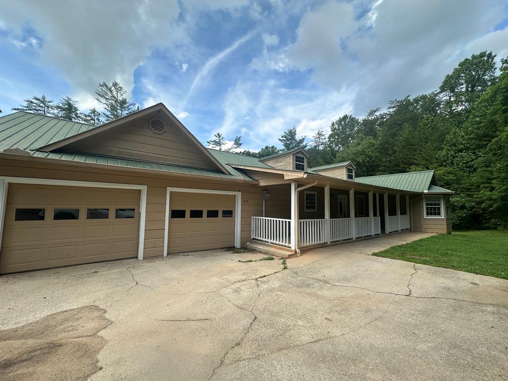 655 Sunset Drive Young Harris, GA 30582 - Photo 1 of 16 a view of a house with a backyard and a window