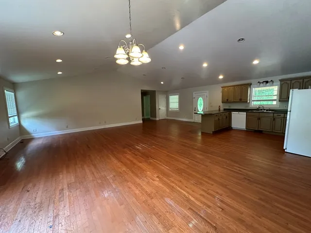 a view of a kitchen with a sink and microwave