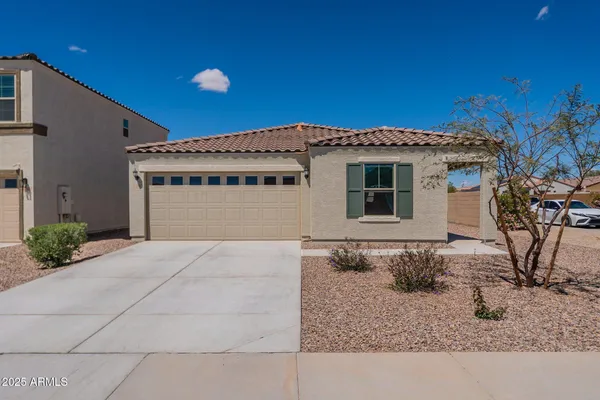 a front view of a house with basket ball court and outdoor seating