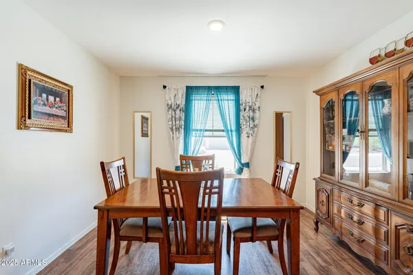 a view of a dining room with furniture window and wooden floor
