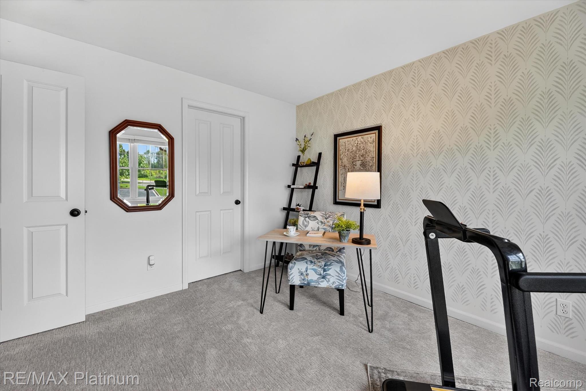 4191 Hampton Ridge Boulevard, Unit 41 Howell, MI 48843 - Photo 14 of 23 Office with wallpapered walls, light carpet, and an accent wall