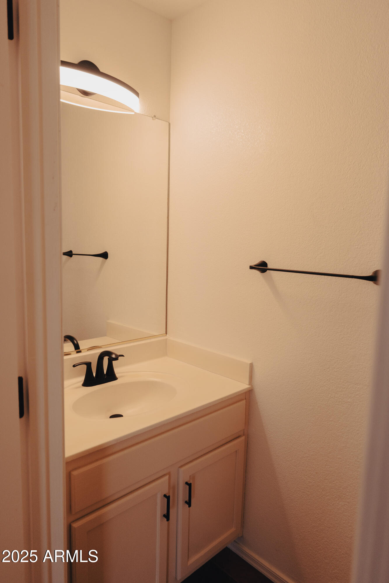 4705 East Jaeger Road Phoenix, AZ 85050 - Photo 11 of 44 a bathroom with a sink and a mirror