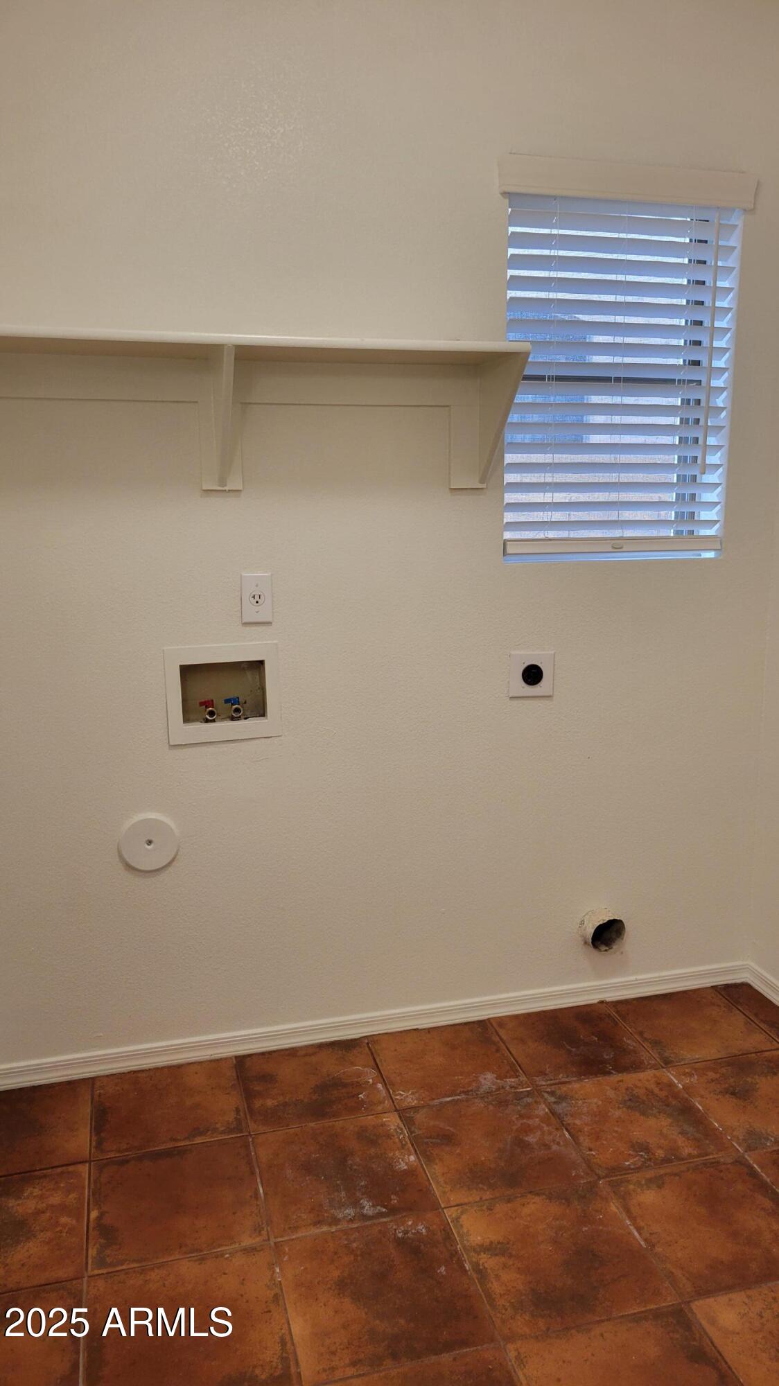 4705 East Jaeger Road Phoenix, AZ 85050 - Photo 13 of 44 a view of an empty room with wooden floor and a window