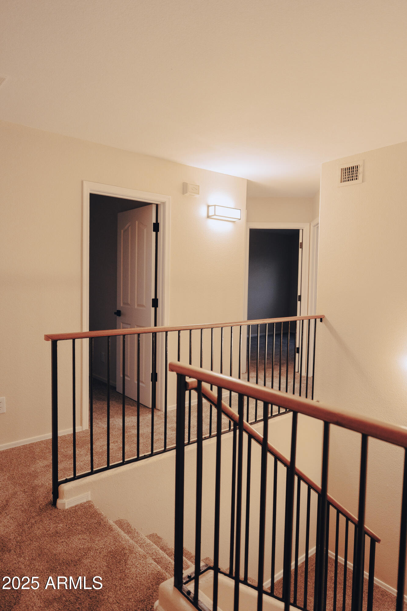 4705 East Jaeger Road Phoenix, AZ 85050 - Photo 24 of 44 a view of staircase with railing and a rug