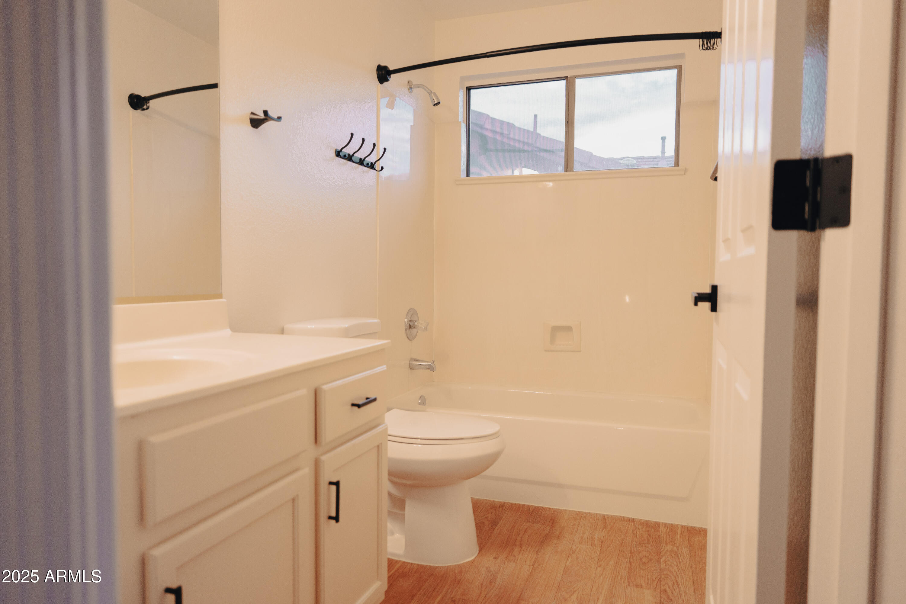 4705 East Jaeger Road Phoenix, AZ 85050 - Photo 27 of 44 a bathroom with a sink toilet and shower