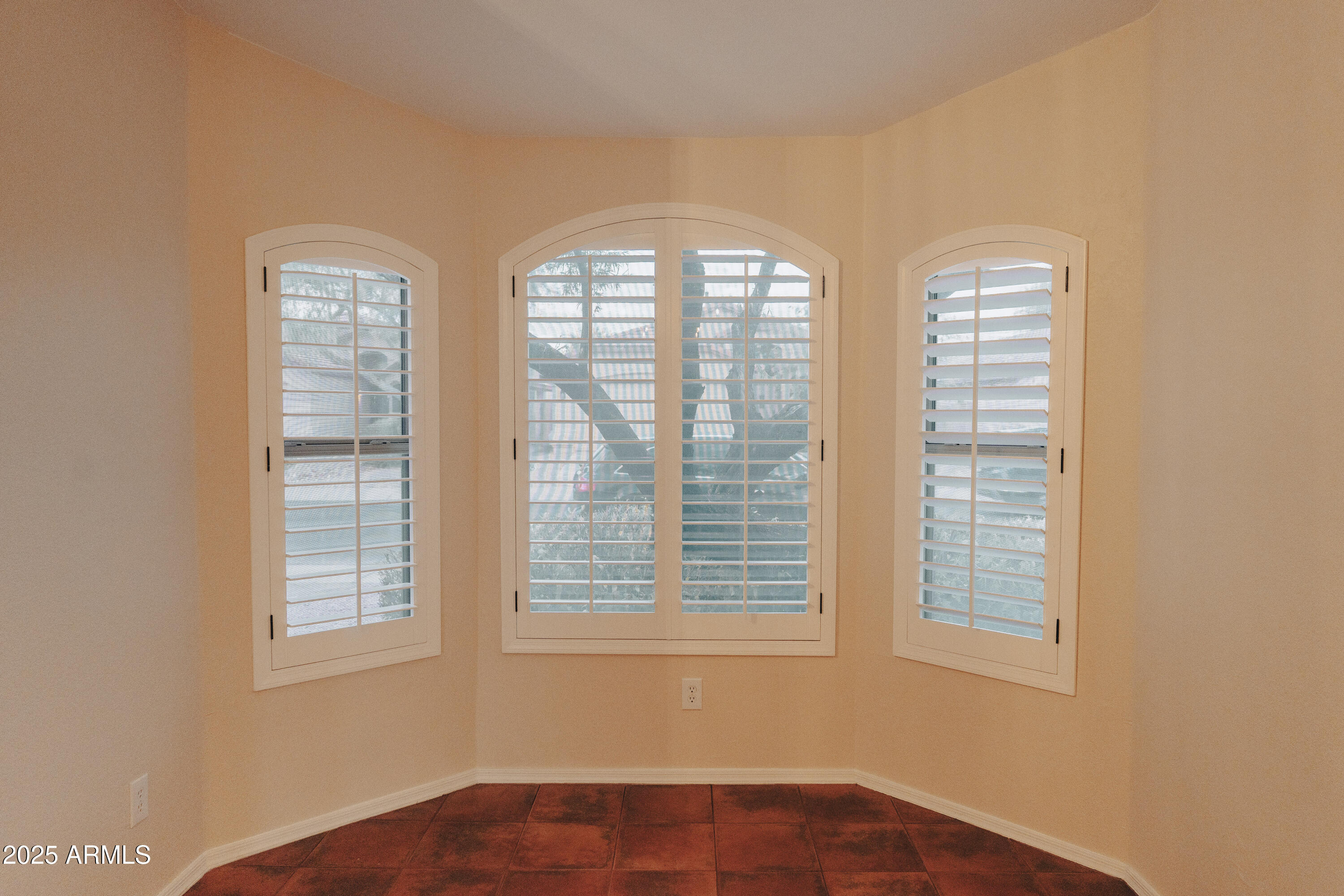 4705 East Jaeger Road Phoenix, AZ 85050 - Photo 3 of 44 a view of an empty room with a window
