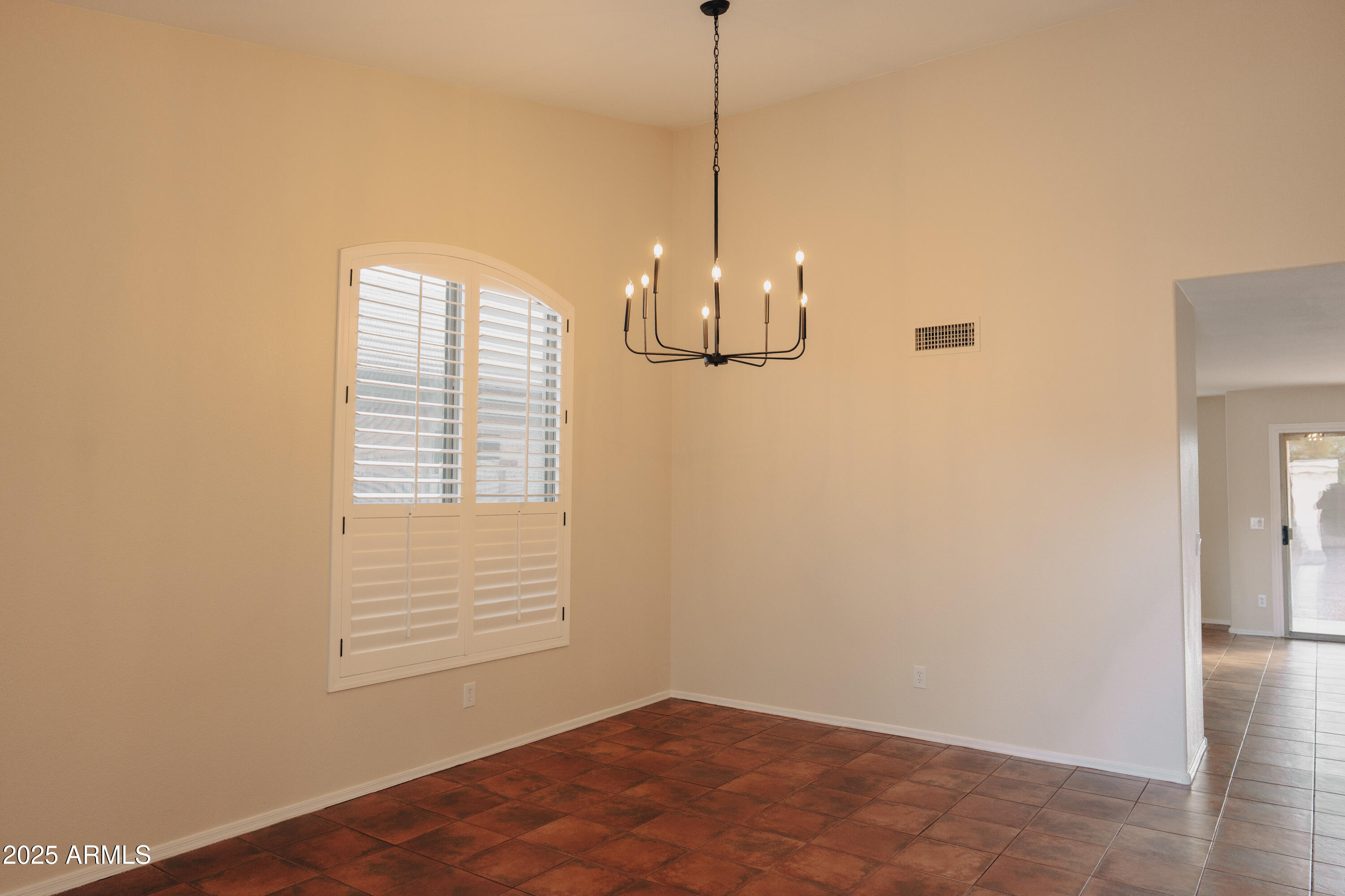 4705 East Jaeger Road Phoenix, AZ 85050 - Photo 4 of 44 a view of an empty room with a window