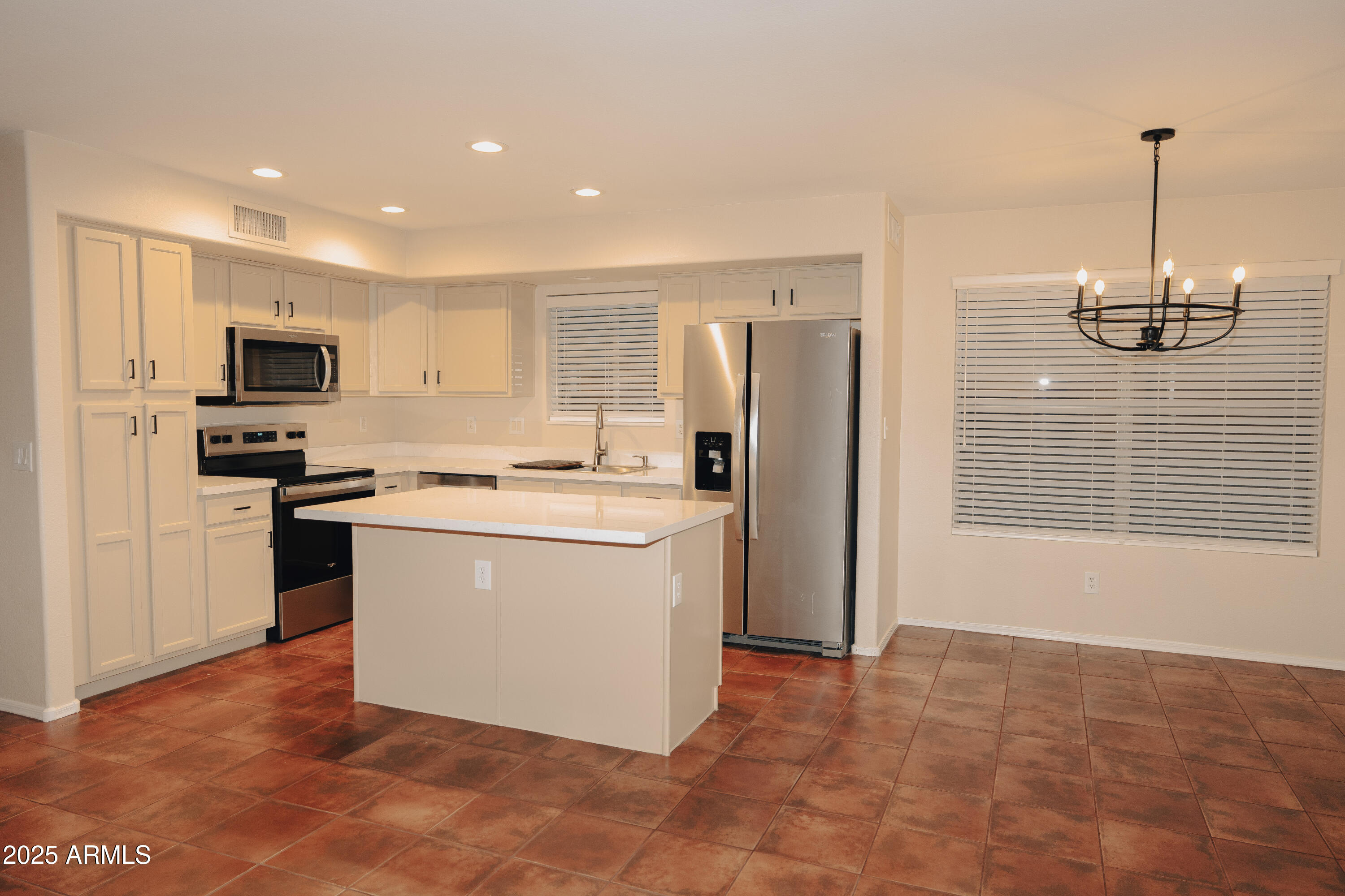 4705 East Jaeger Road Phoenix, AZ 85050 - Photo 5 of 44 a kitchen with stainless steel appliances granite countertop a refrigerator a stove a sink and a microwave