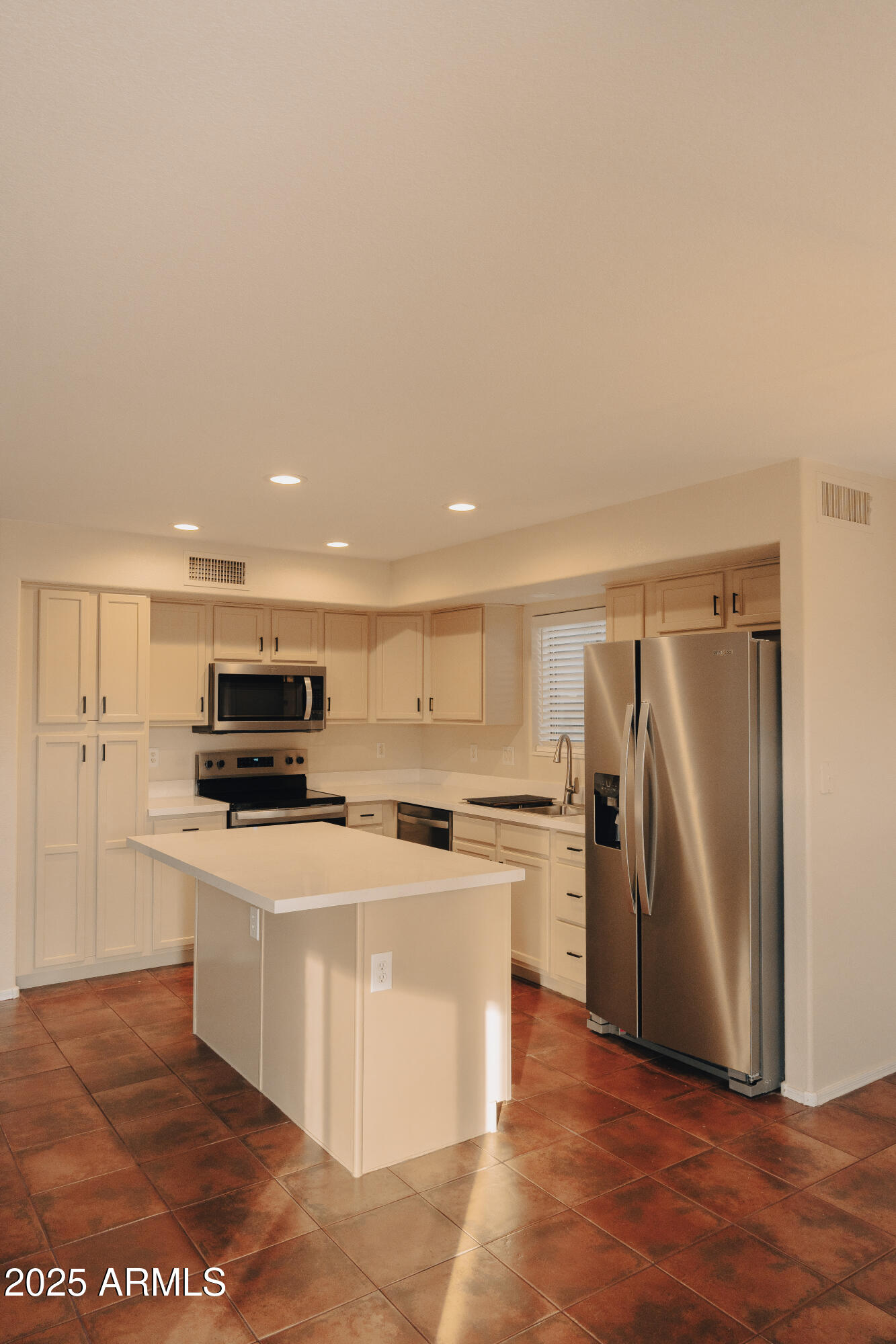 4705 East Jaeger Road Phoenix, AZ 85050 - Photo 8 of 44 a kitchen with stainless steel appliances a stove a refrigerator and a refrigerator