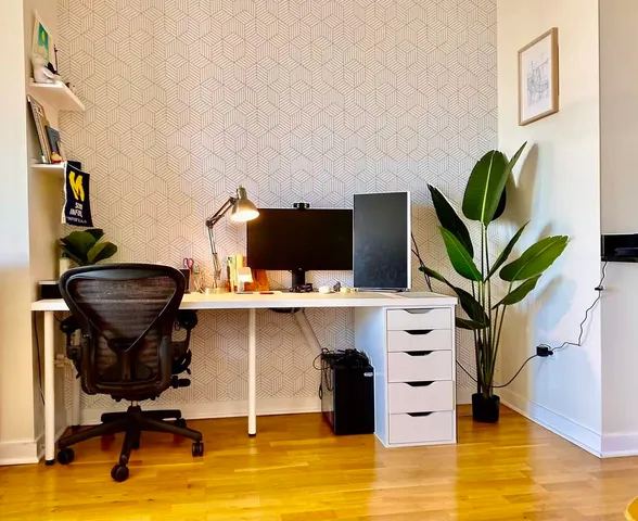 a view of a workspace with furniture