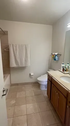 a bathroom with a sink a toilet and mirror