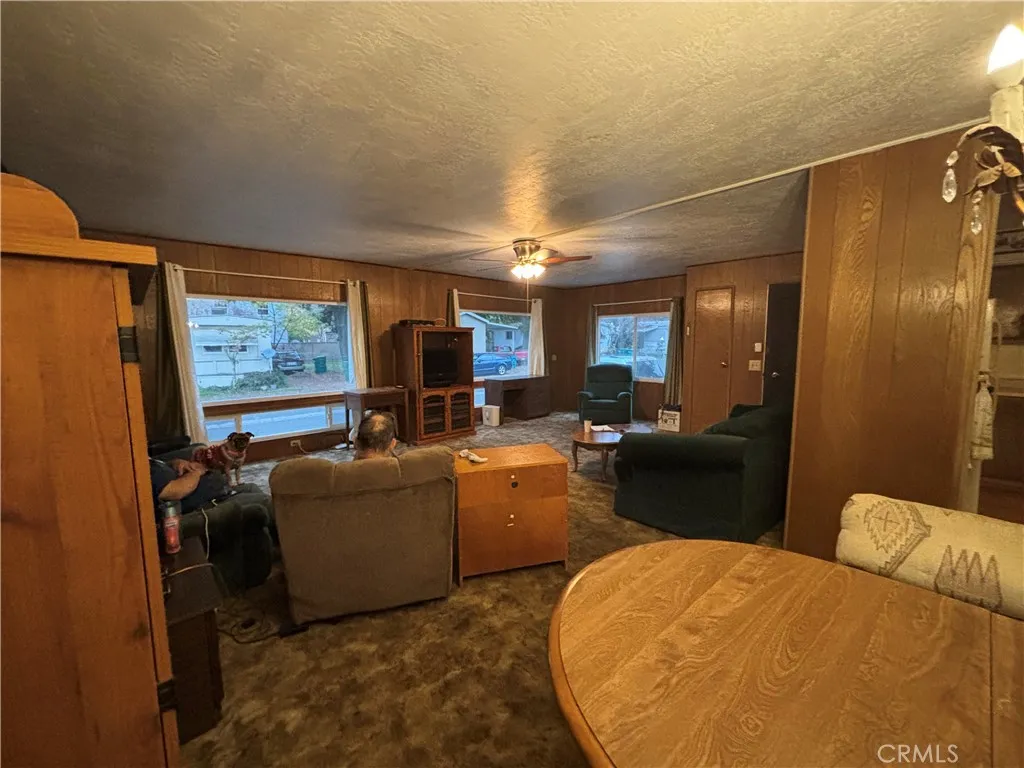 3156 Esplanade, Unit 306 Chico, CA 95973 - Photo 14 of 18 a living room with furniture a large window and flat screen tv