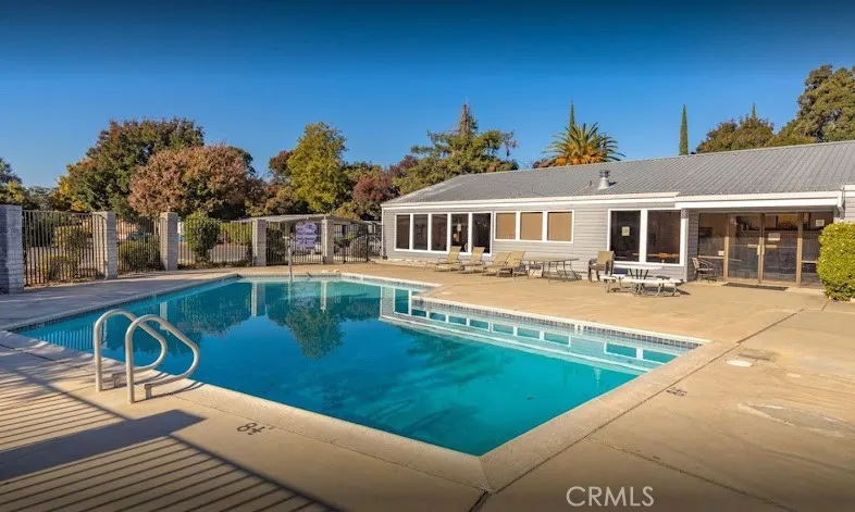 3156 Esplanade, Unit 306 Chico, CA 95973 - Photo 15 of 18 a view of a house with pool and chairs