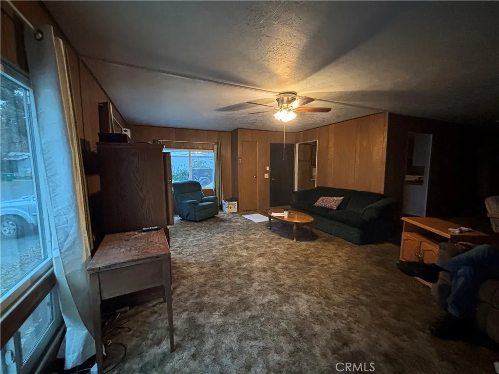 3156 Esplanade, Unit 306 Chico, CA 95973 - Photo 2 of 18 a living room with furniture and a flat screen tv