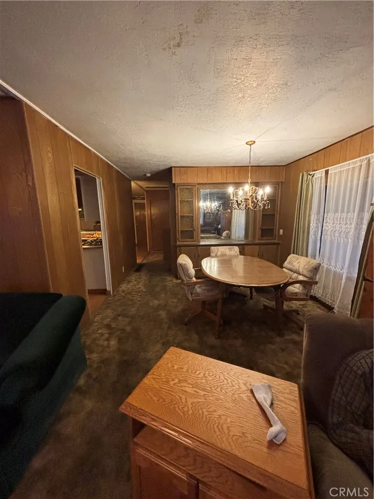 3156 Esplanade, Unit 306 Chico, CA 95973 - Photo 3 of 18 a room with a couch and wooden floor