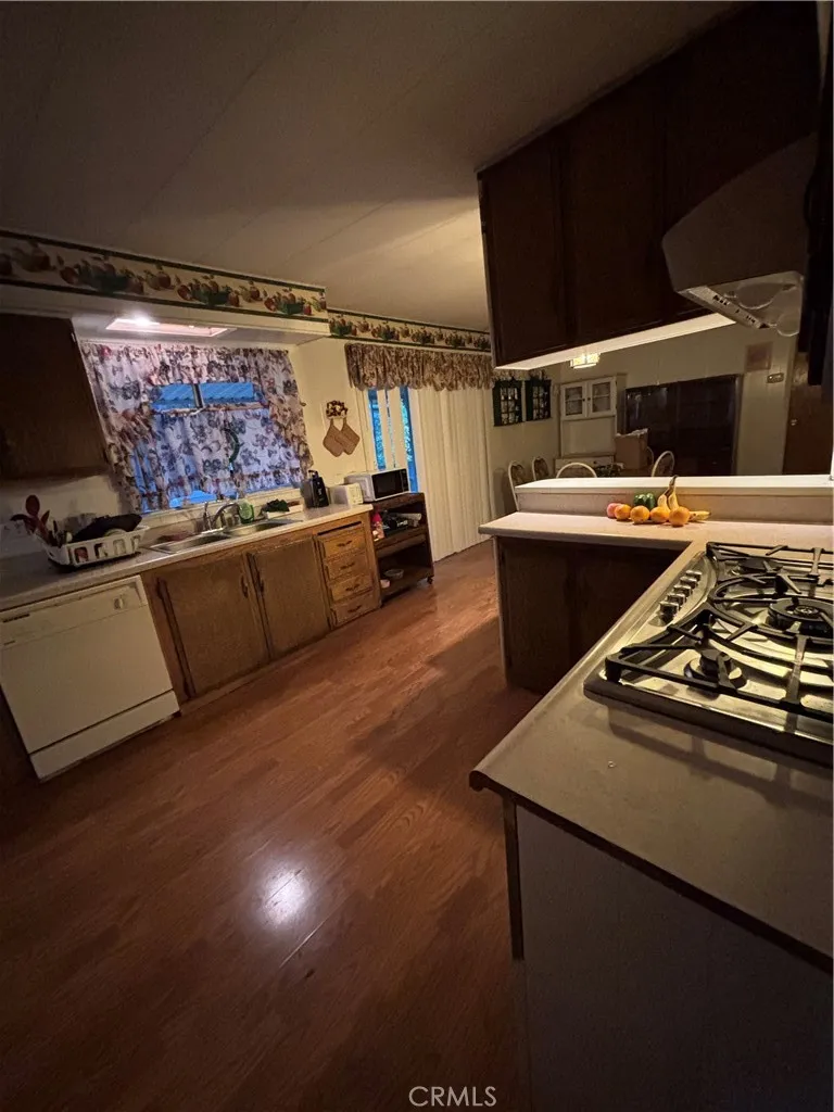 3156 Esplanade, Unit 306 Chico, CA 95973 - Photo 4 of 18 a room with furniture and flat screen tv