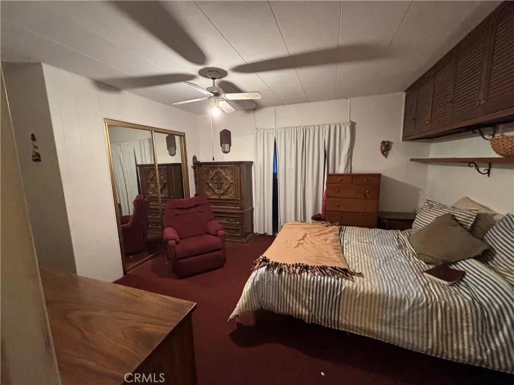 3156 Esplanade, Unit 306 Chico, CA 95973 - Photo 5 of 18 a bedroom with a bed and wooden floor