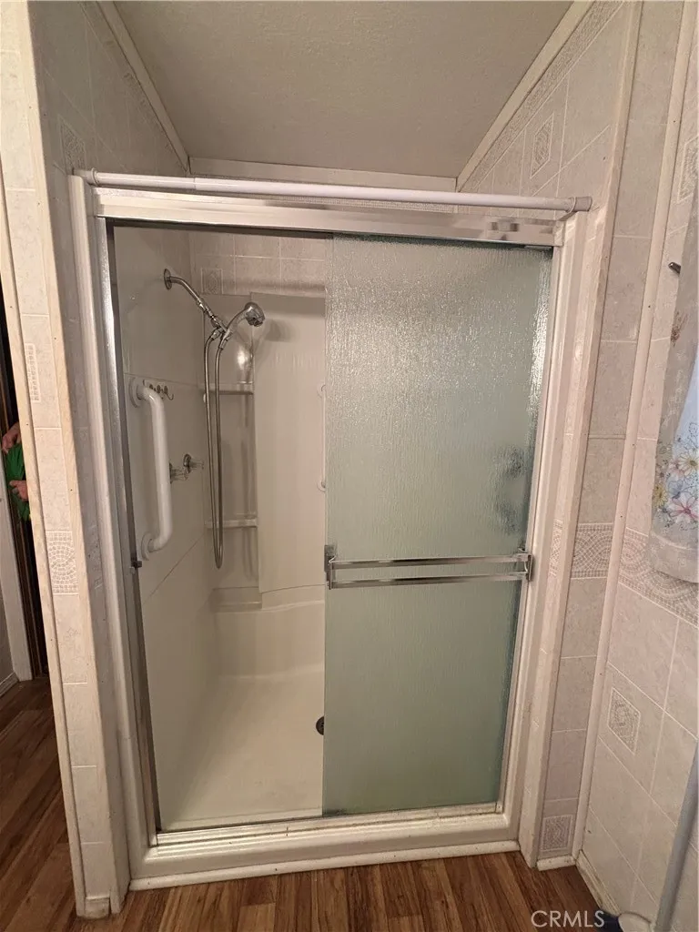 3156 Esplanade, Unit 306 Chico, CA 95973 - Photo 8 of 18 a bathroom with a glass shower door