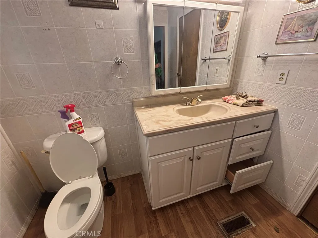 3156 Esplanade, Unit 306 Chico, CA 95973 - Photo 9 of 18 a bathroom with a toilet sink and mirror