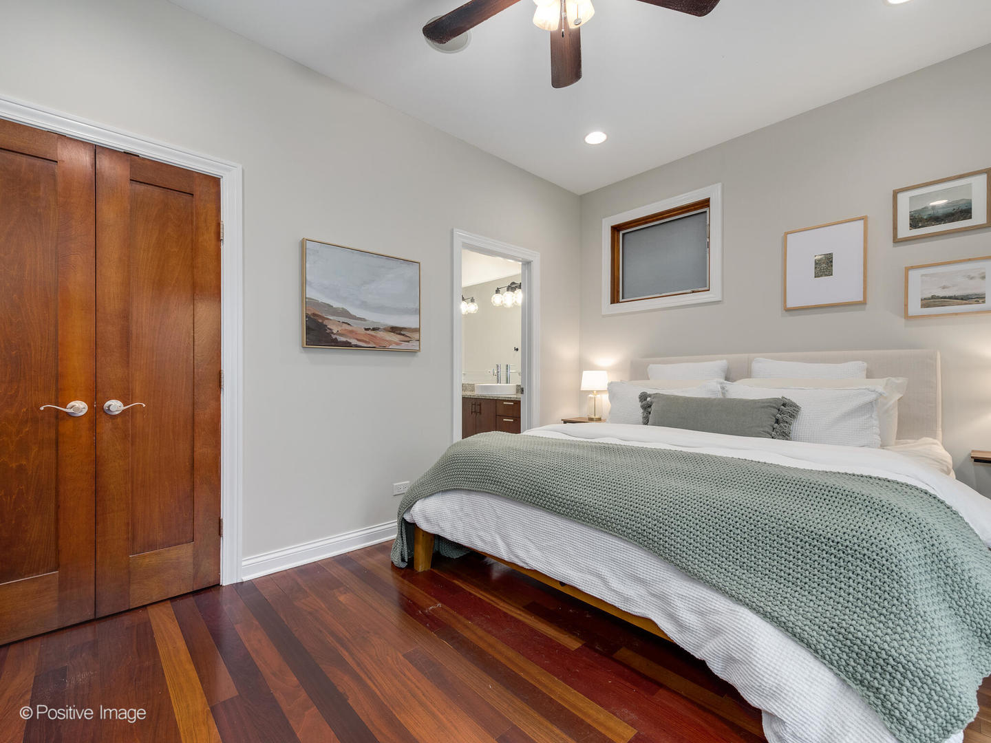 2033 West Crystal Street, Unit 2 Chicago, IL 60622 - Photo 16 of 22 a bedroom with a bed and a chandelier