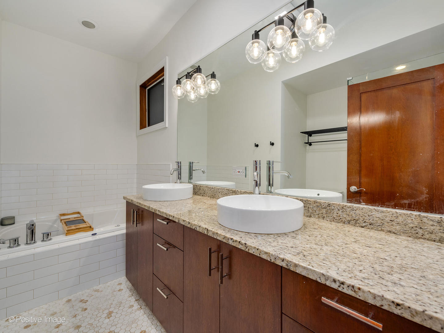 2033 West Crystal Street, Unit 2 Chicago, IL 60622 - Photo 18 of 22 a bathroom with a granite countertop double vanity sink and a mirror