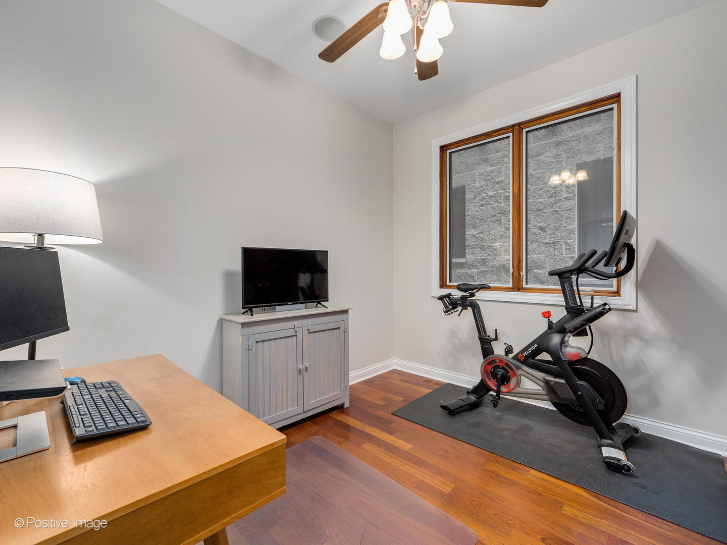 2033 West Crystal Street, Unit 2 Chicago, IL 60622 - Photo 20 of 22 a view of a workspace with furniture and a flat screen tv