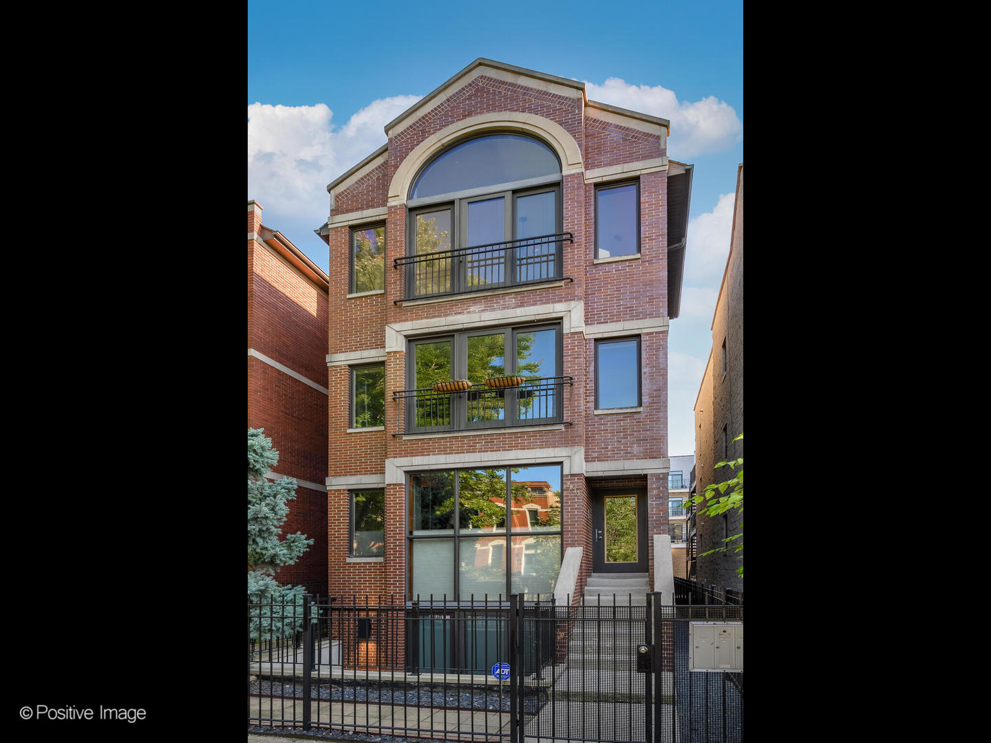 2033 West Crystal Street, Unit 2 Chicago, IL 60622 - Photo 2 of 22 a view of a brick building with many windows