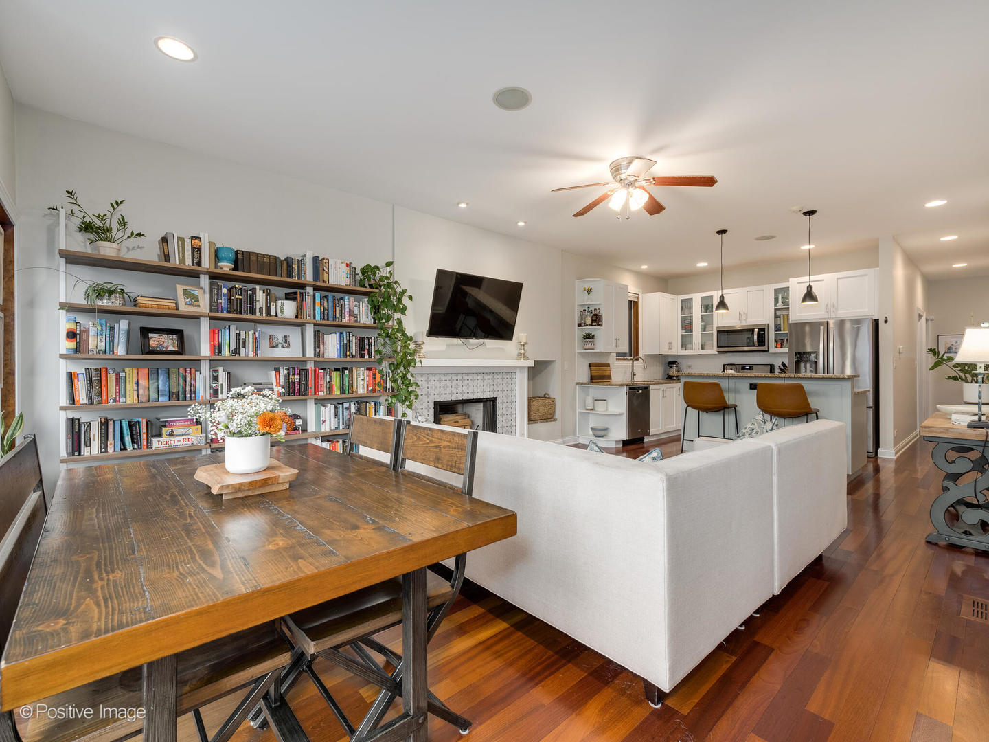 2033 West Crystal Street, Unit 2 Chicago, IL 60622 - Photo 8 of 22 a living room with fireplace furniture and a flat screen tv