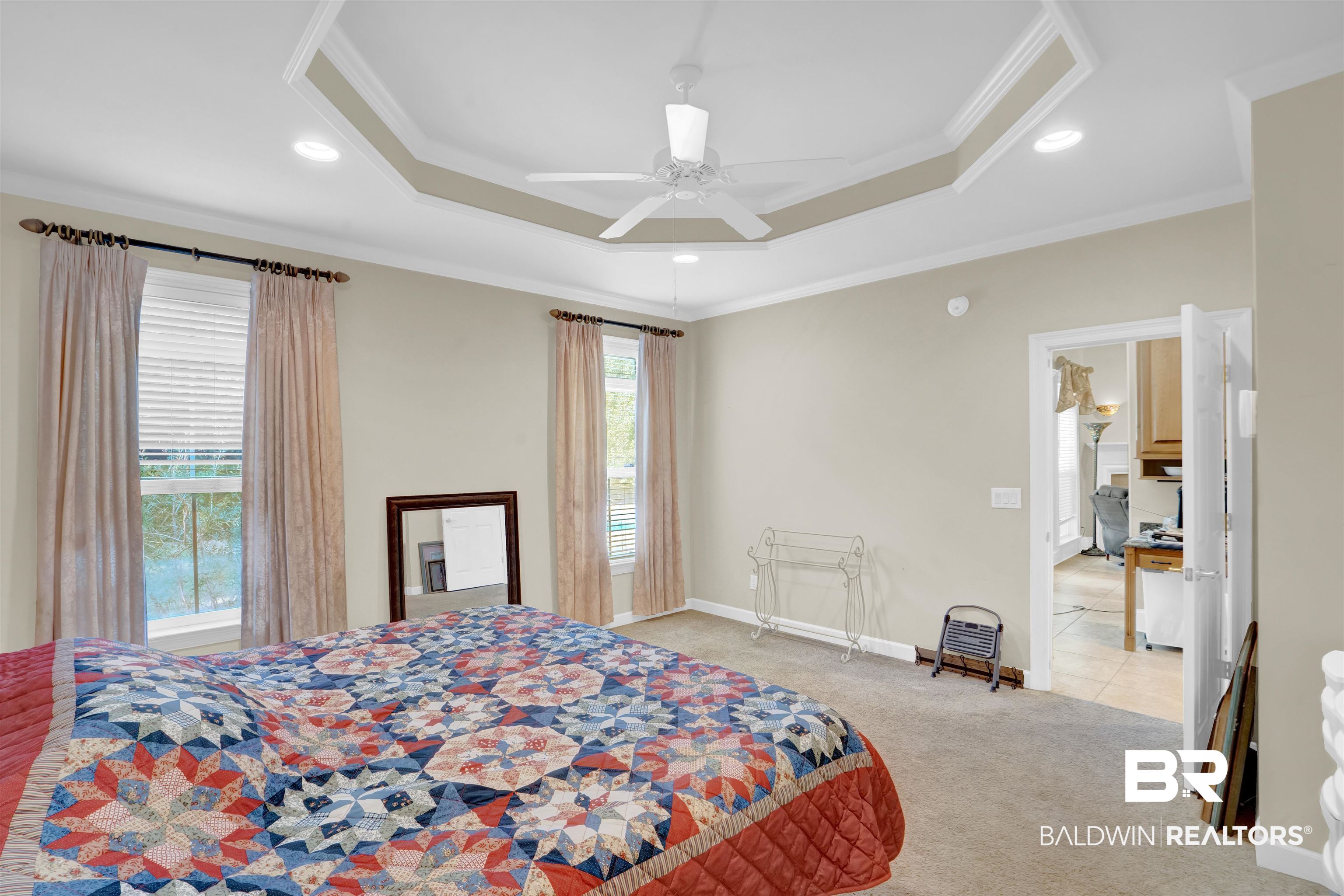 10951 Driver Court Fairhope, AL 36532 - Photo 24 of 46 Carpeted bedroom with ceiling fan, a tray ceiling, and crown molding