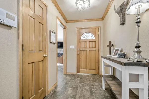 a view of a kitchen cabinets and wooden floor