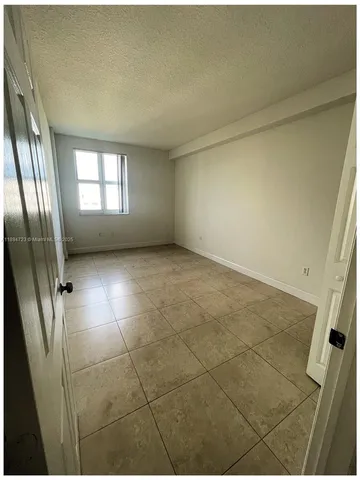 a view of empty room with windows