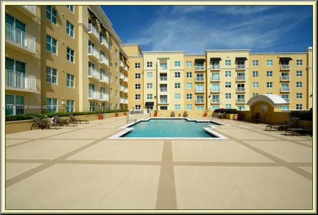 a view of a swimming pool with a patio
