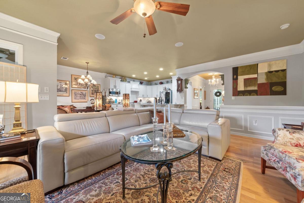 1151 Spring Station Road Greensboro, GA 30642 - Photo 12 of 60 a living room with furniture and kitchen view