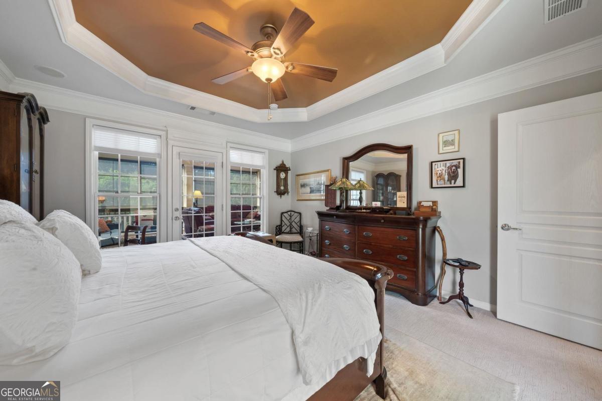 1151 Spring Station Road Greensboro, GA 30642 - Photo 25 of 60 a bedroom with a bed dresser and a window