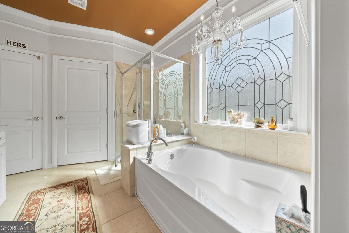 1151 Spring Station Road Greensboro, GA 30642 - Photo 28 of 60 a spacious bathroom with a tub and shower