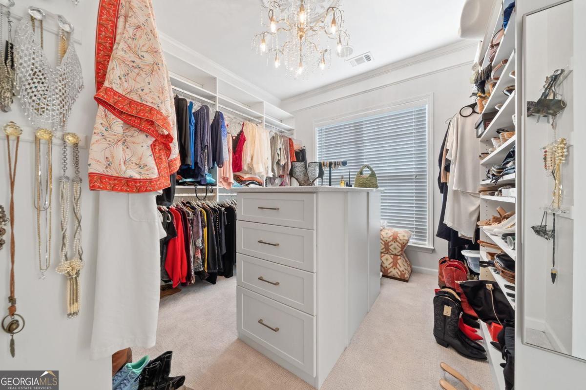 1151 Spring Station Road Greensboro, GA 30642 - Photo 30 of 60 a view of walk in closet with clothes
