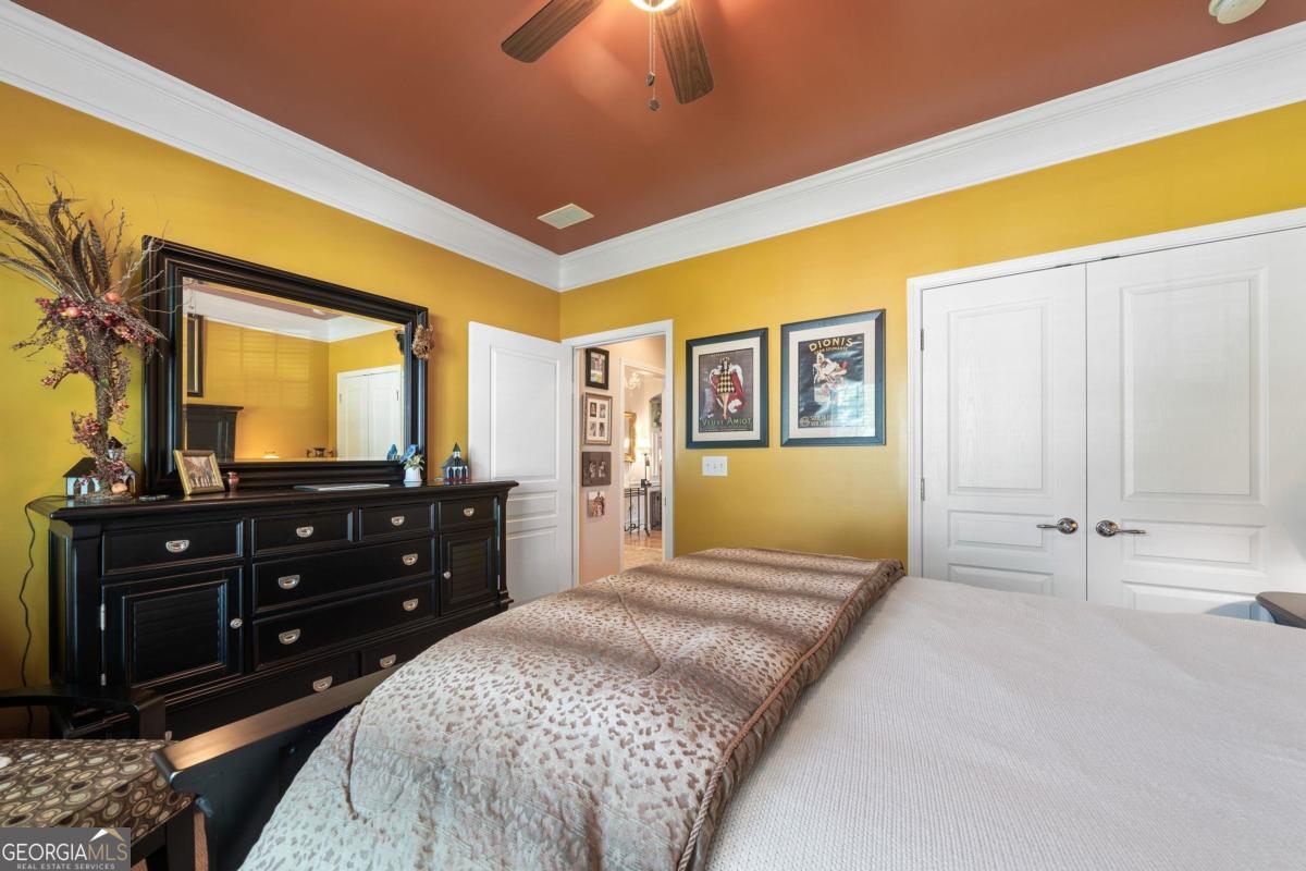 1151 Spring Station Road Greensboro, GA 30642 - Photo 32 of 60 a bedroom with a bed and a dresser