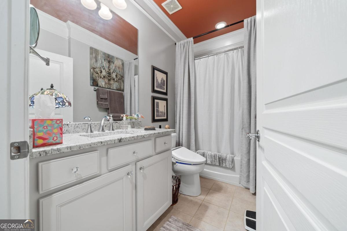 1151 Spring Station Road Greensboro, GA 30642 - Photo 33 of 60 a bathroom with a toilet sink and mirror