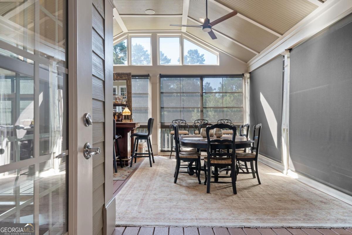 1151 Spring Station Road Greensboro, GA 30642 - Photo 35 of 60 a dining room with furniture window and wooden floor