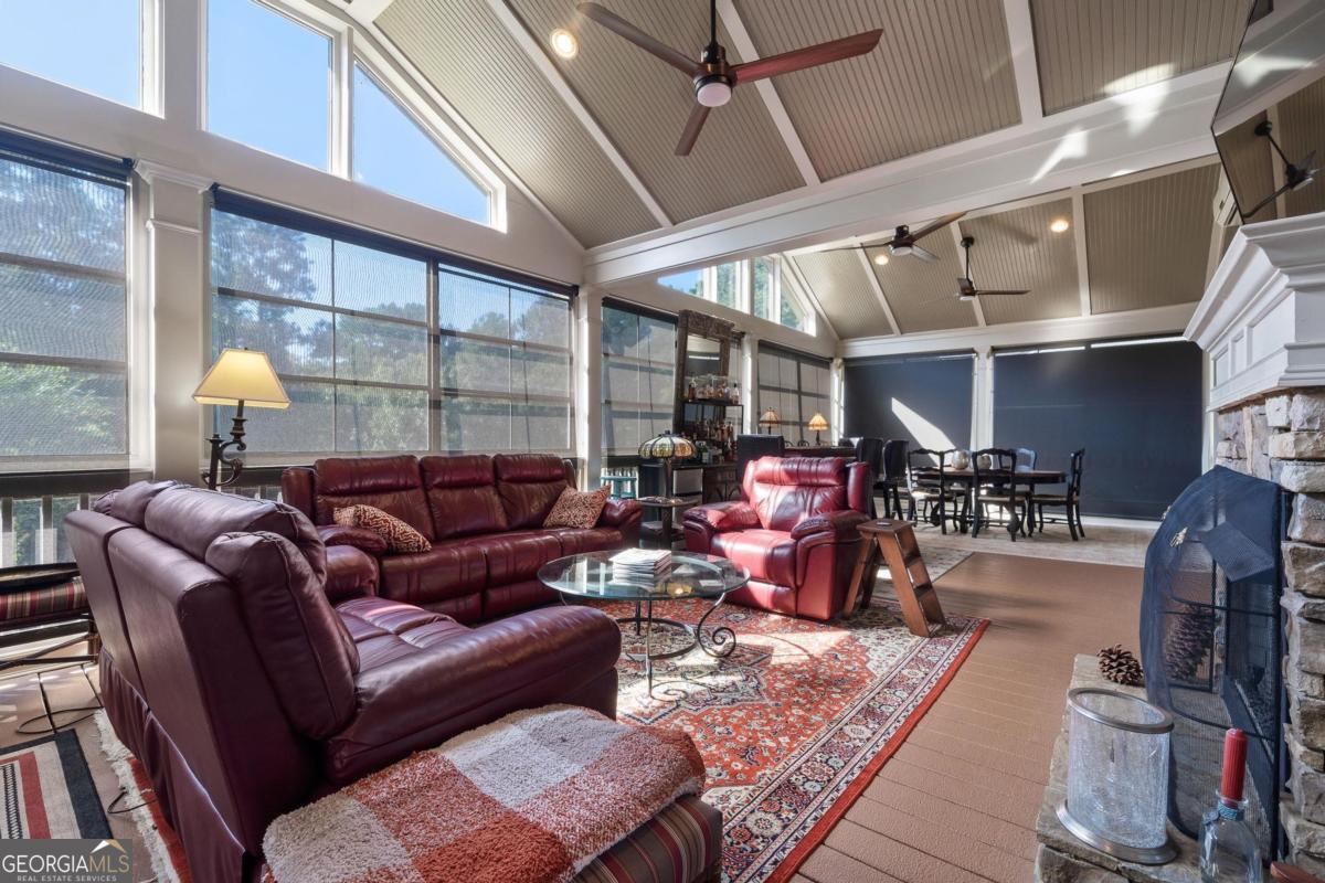 1151 Spring Station Road Greensboro, GA 30642 - Photo 38 of 60 a living room with furniture and a wooden floor