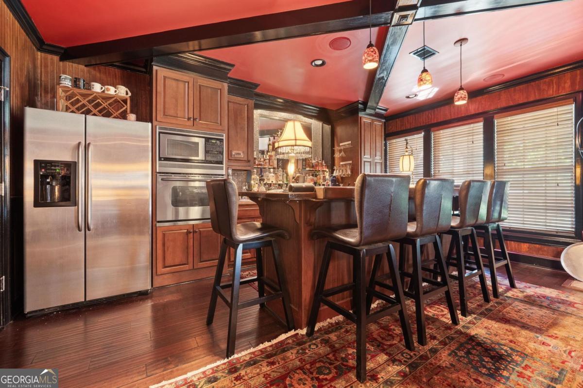 1151 Spring Station Road Greensboro, GA 30642 - Photo 45 of 60 a view of a dining room with furniture window and wooden floor