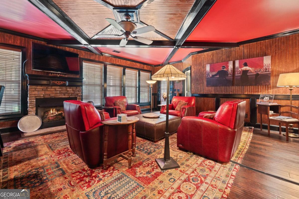 1151 Spring Station Road Greensboro, GA 30642 - Photo 46 of 60 a living room with lots of furniture and a flat screen tv