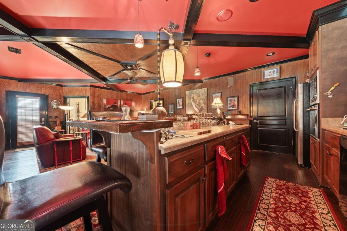1151 Spring Station Road Greensboro, GA 30642 - Photo 49 of 60 a kitchen that has a lot of cabinets in it