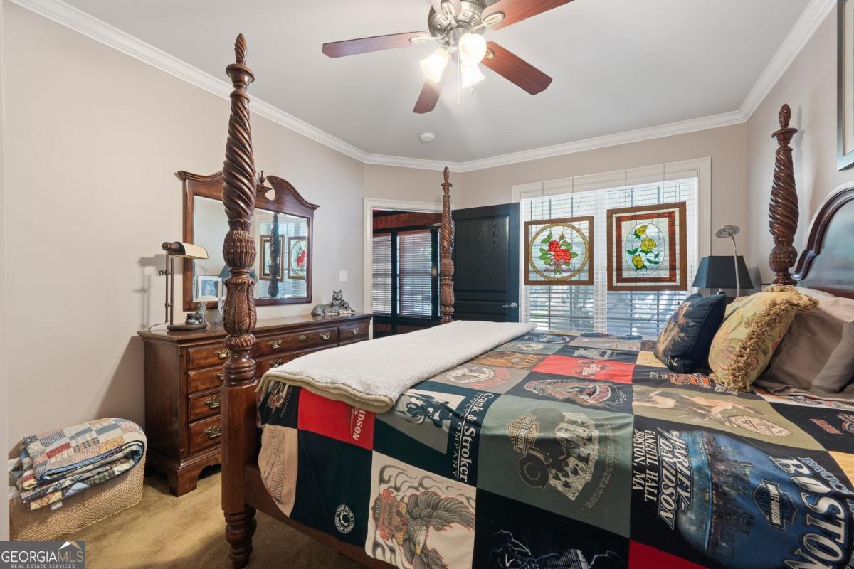 1151 Spring Station Road Greensboro, GA 30642 - Photo 51 of 60 a bedroom with bed and wooden floor