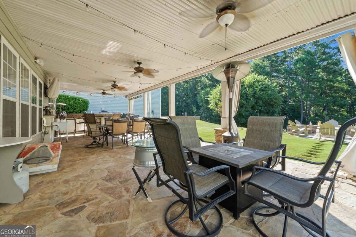 1151 Spring Station Road Greensboro, GA 30642 - Photo 53 of 60 a view of a patio with a table and chairs