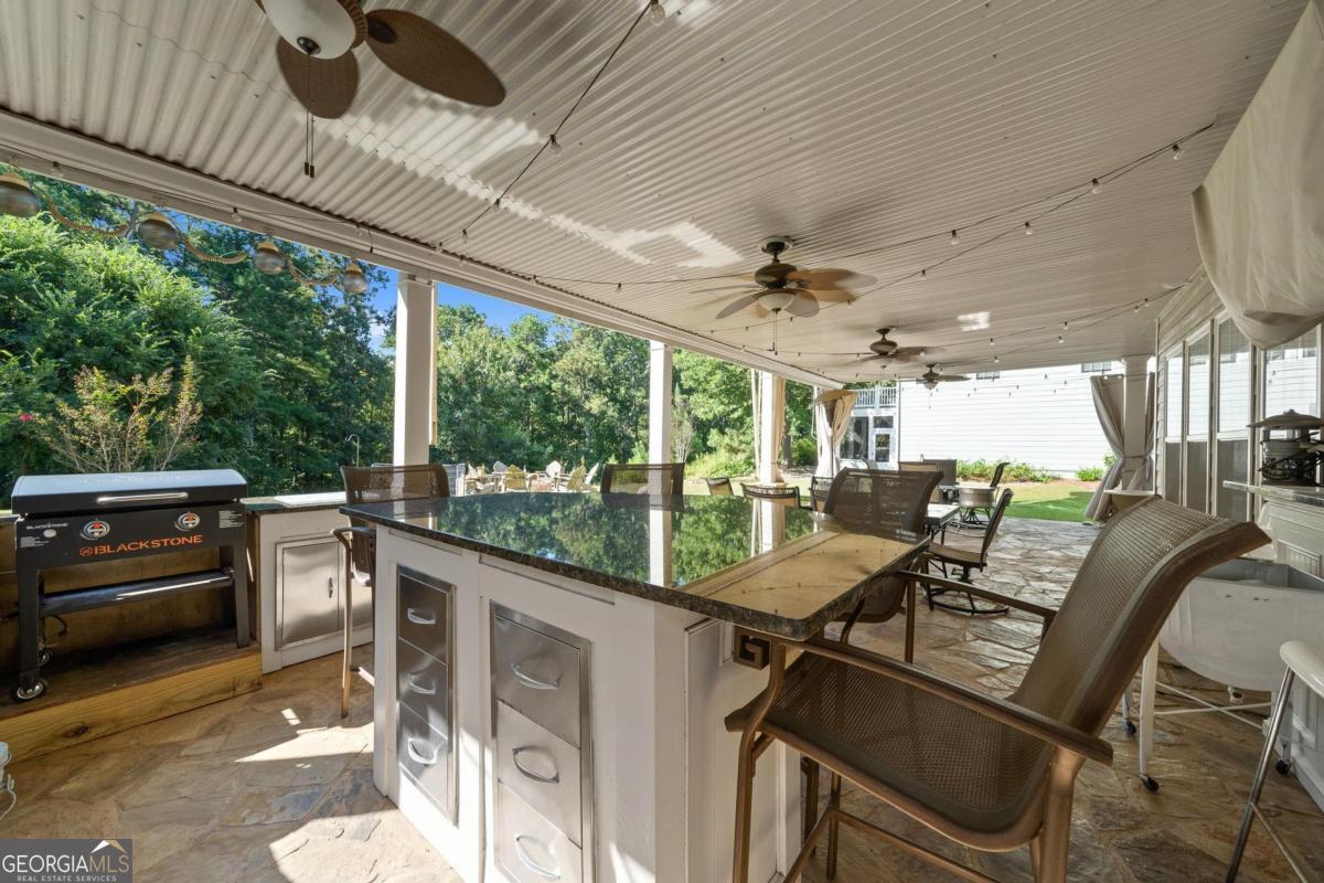 1151 Spring Station Road Greensboro, GA 30642 - Photo 55 of 60 a view of a patio with table and chairs