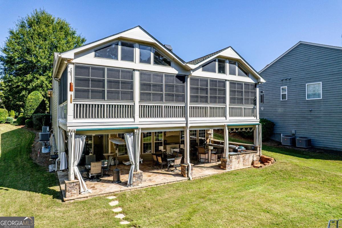 1151 Spring Station Road Greensboro, GA 30642 - Photo 58 of 60 a front view of a house with a yard glass windows and slide