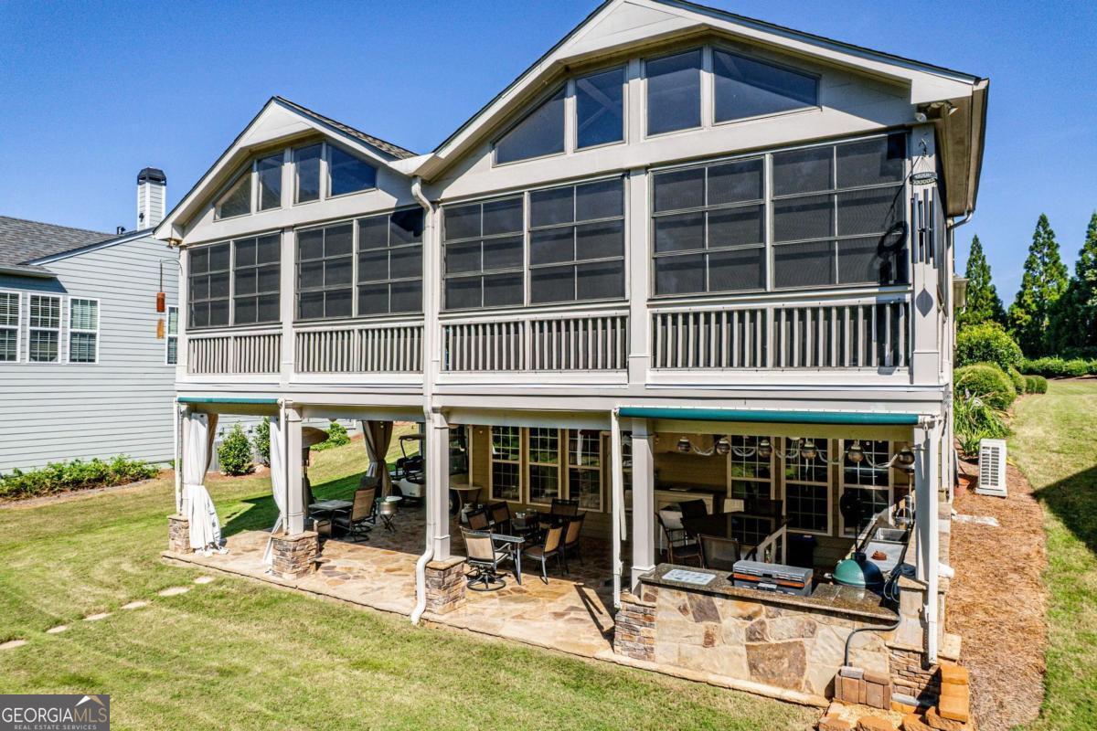 1151 Spring Station Road Greensboro, GA 30642 - Photo 59 of 60 front view of a building with a garden