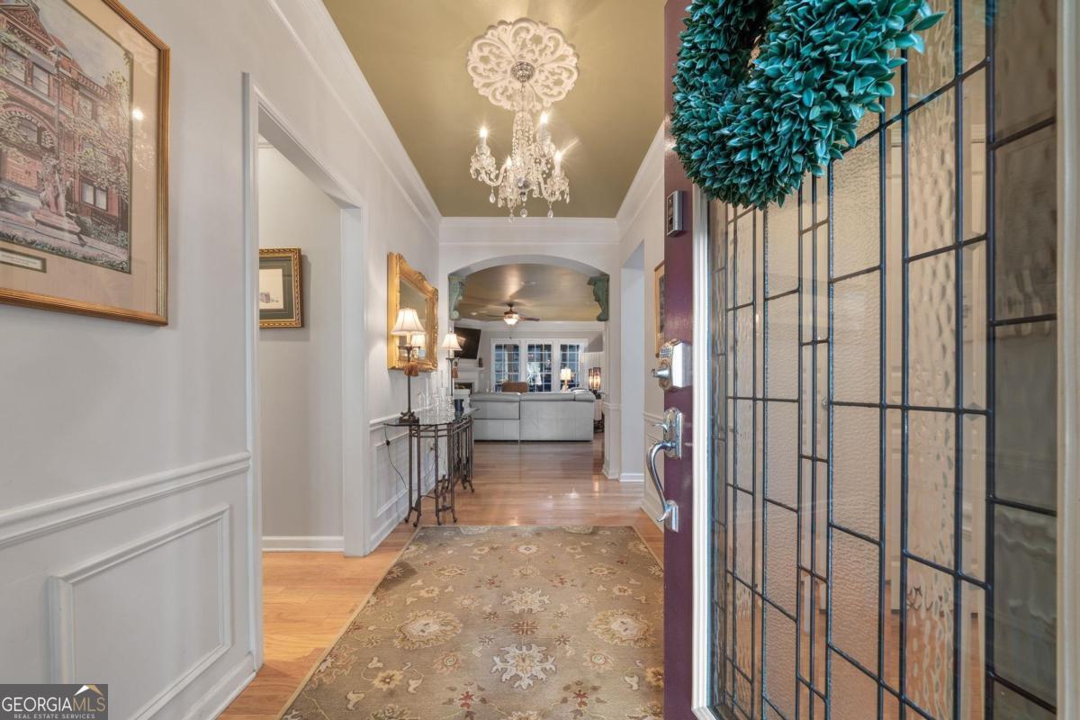 1151 Spring Station Road Greensboro, GA 30642 - Photo 8 of 60 a view of a hallway to a livingroom with furniture